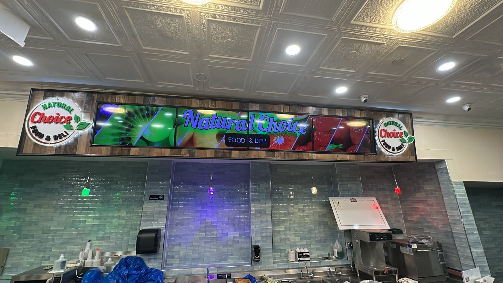 Five synchronized digital displays installed at Natural Choice Food and Deli